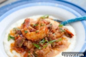 A blue and white bowl filled with shrimp and grits.