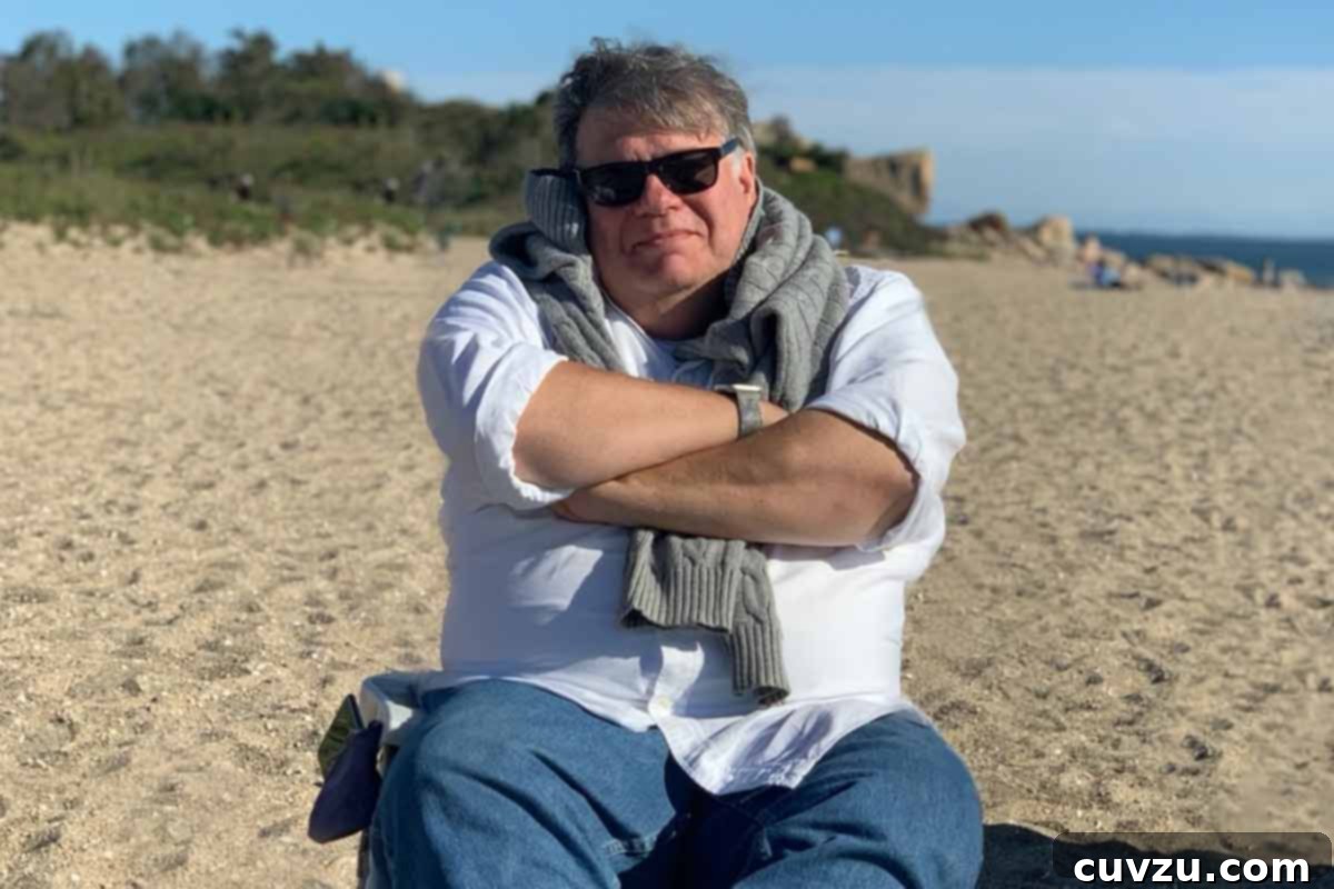 9 Must-Try Beach Picnic Dishes 2 A man on a beach chair, bundled up in a sweater around his neck.