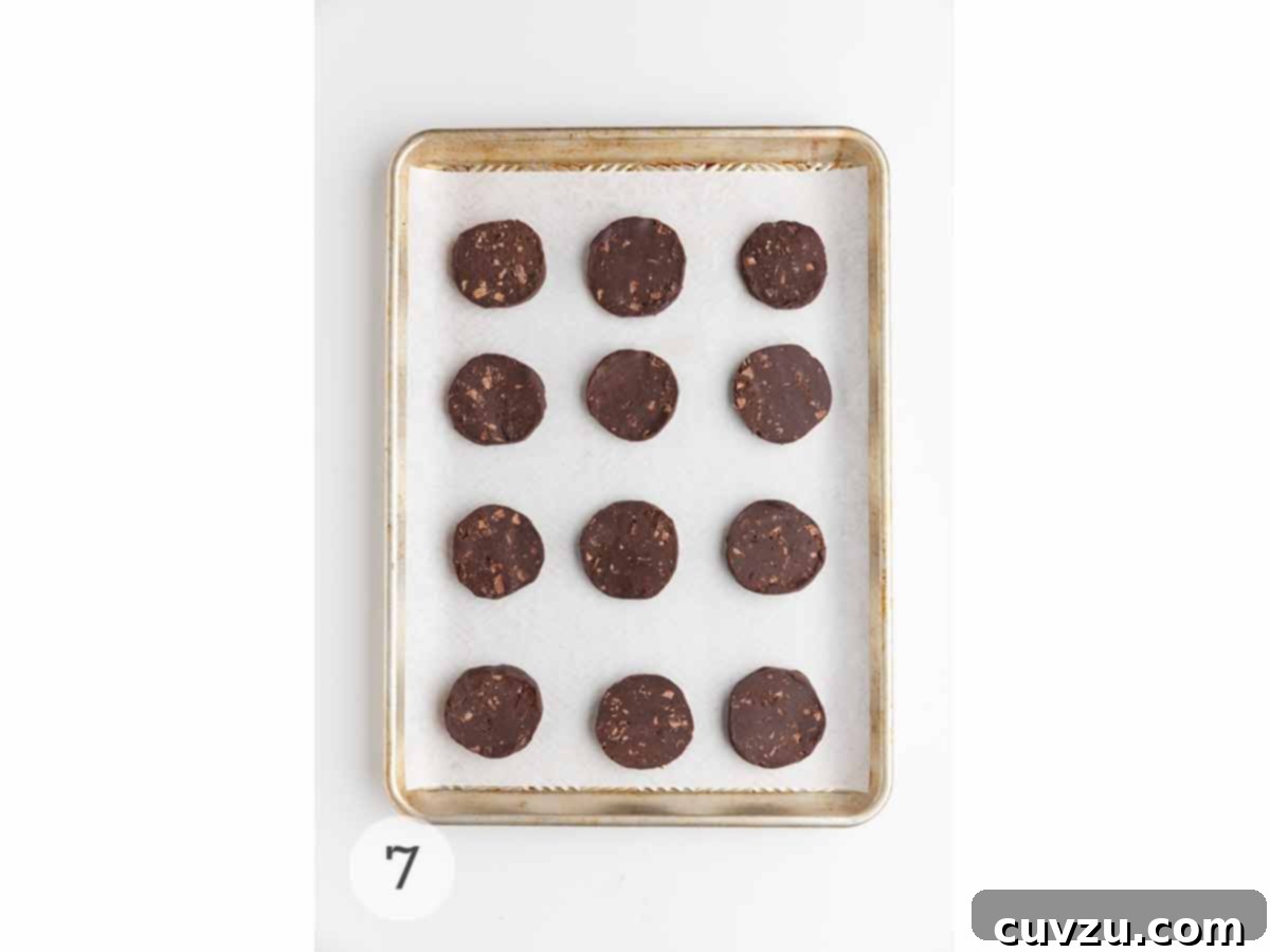 Rich Chocolate Espresso Shortbread 8 A sheet pan with 12 unbaked chocolate espresso shortbread cookies on it.