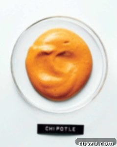 A glass dish filled with chipotle mayonnaise with a typed label below.