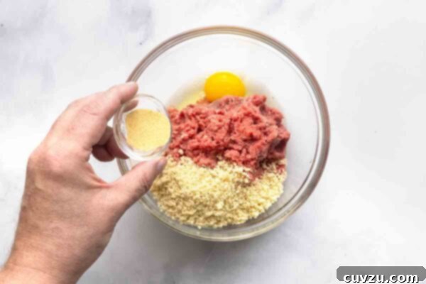 Velvety Meatball Stroganoff 11 Ground beef, panko, and egg in a bowl.