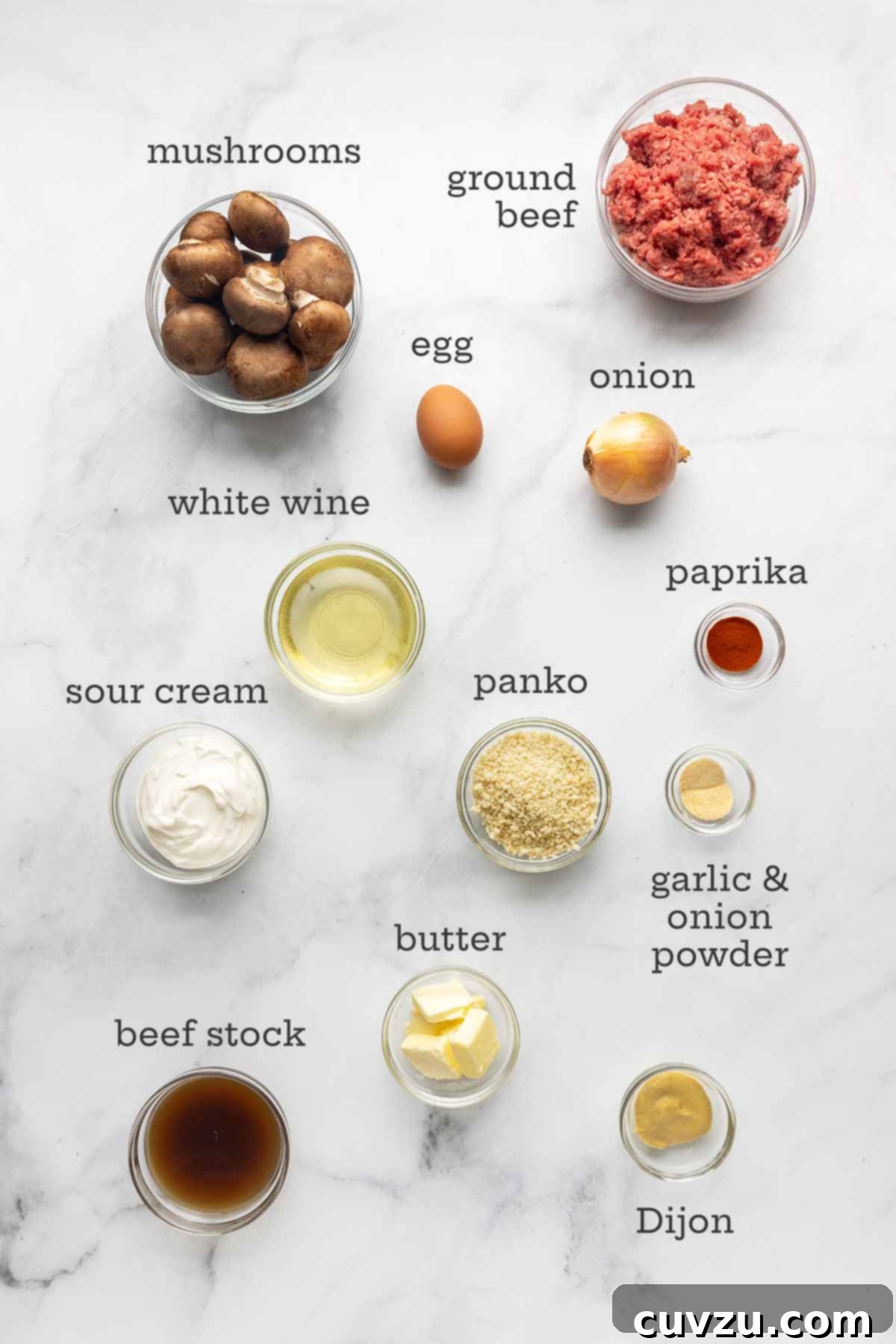 Velvety Meatball Stroganoff 3 The ingredients for meatball Stroganoff--ground beef, mushrooms, white wine, sour cream, egg, onion, paprika, Dijon mustard, beef stock, butter, and garlic and onion powders.
