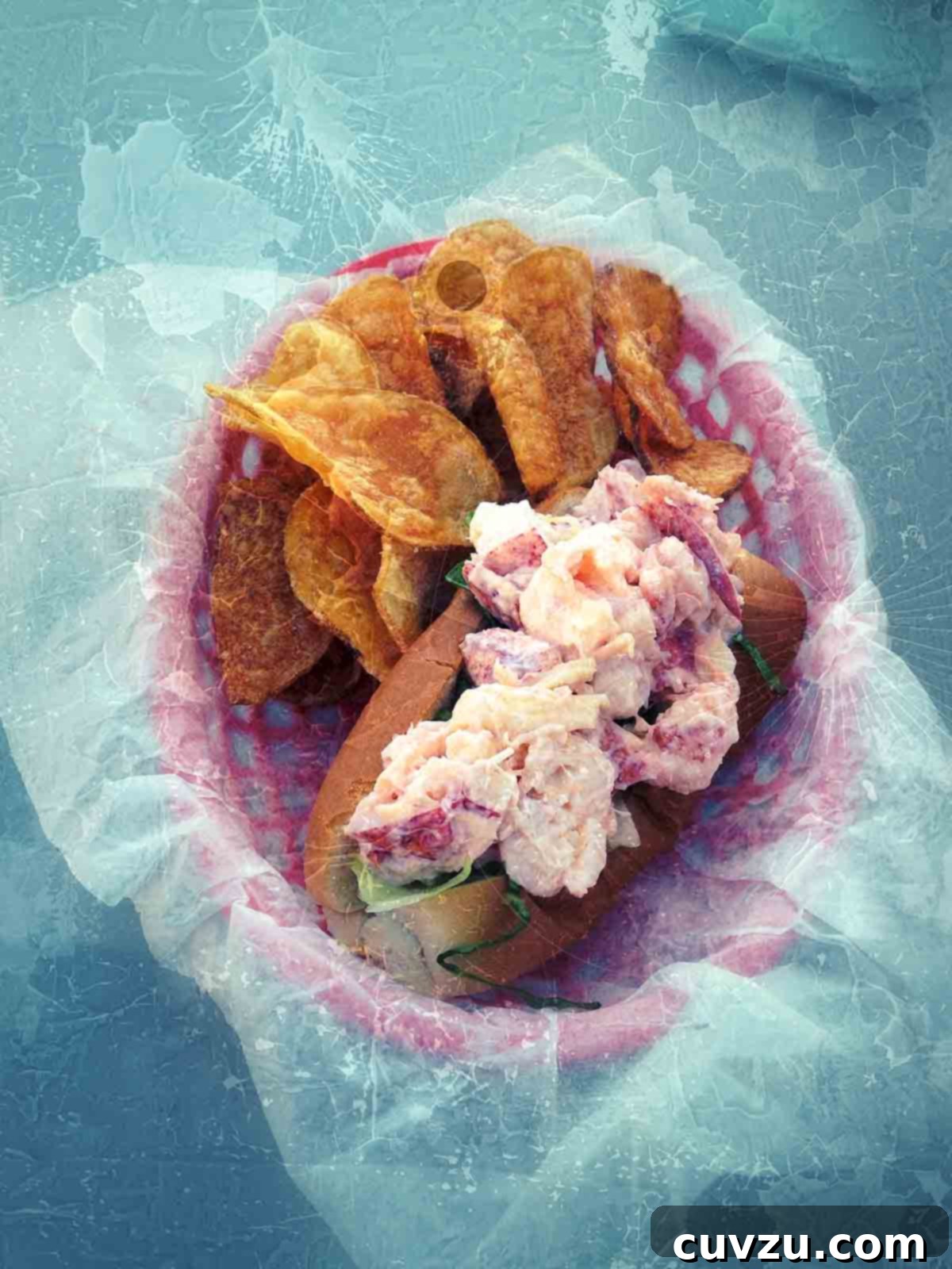 Lobster Rolls Mayo Versus Butter A Flavor Showdown 2 A vibrant lobster roll prepared with creamy mayonnaise, served alongside golden potato chips in a charming pink basket, evoking the quintessential New England summer experience.
