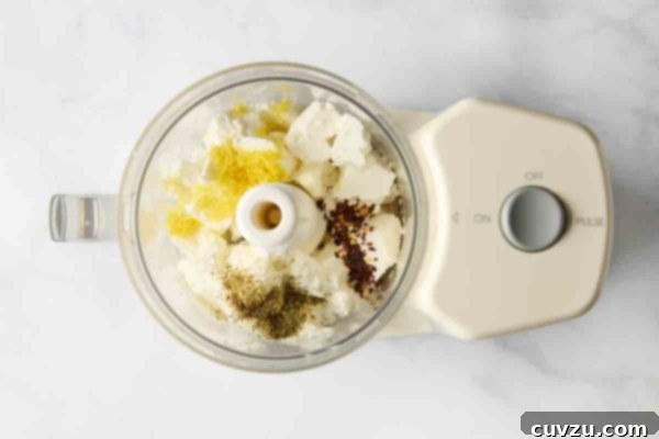 Creamy Whipped Feta 11 Feta, lemon, and spices combined in the bowl of a food processor.