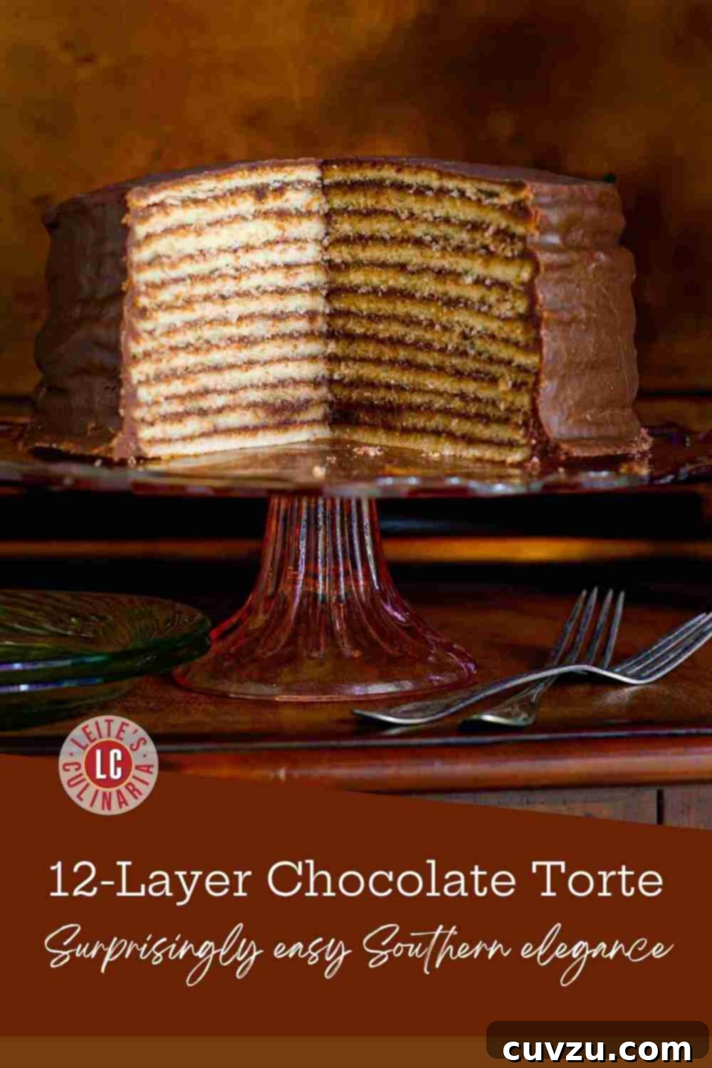 Trisha Yearwood's Decadent Chocolate Torte 3 A magnificent 12-layer vanilla cake featuring a rich, perfectly hardened chocolate glaze, presented on a charming cake stand.