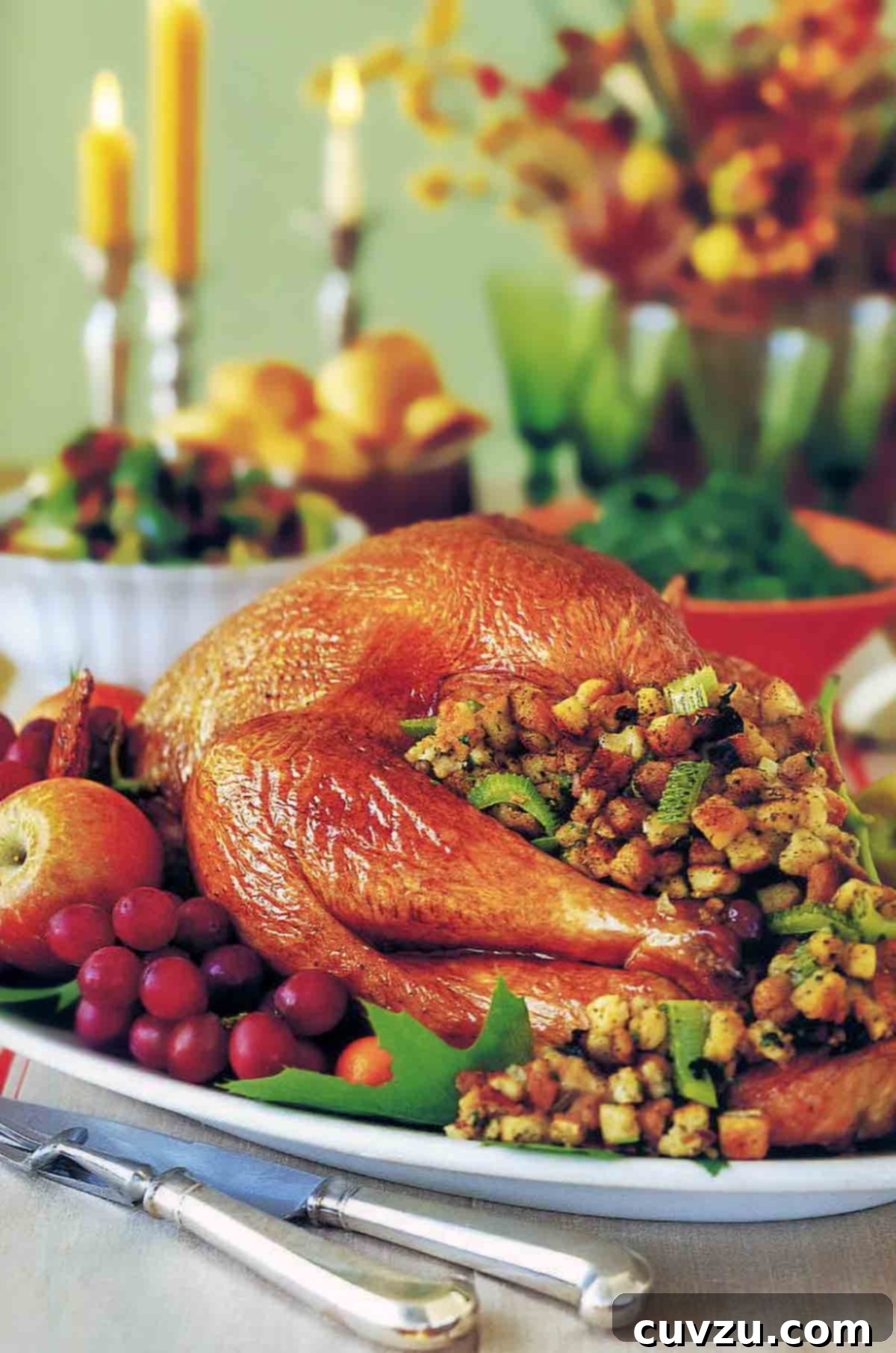 Holiday Turkey with All the Trimmings 2 Thanksgiving table with a roast turkey with stuffing and vegetables on a platter.
