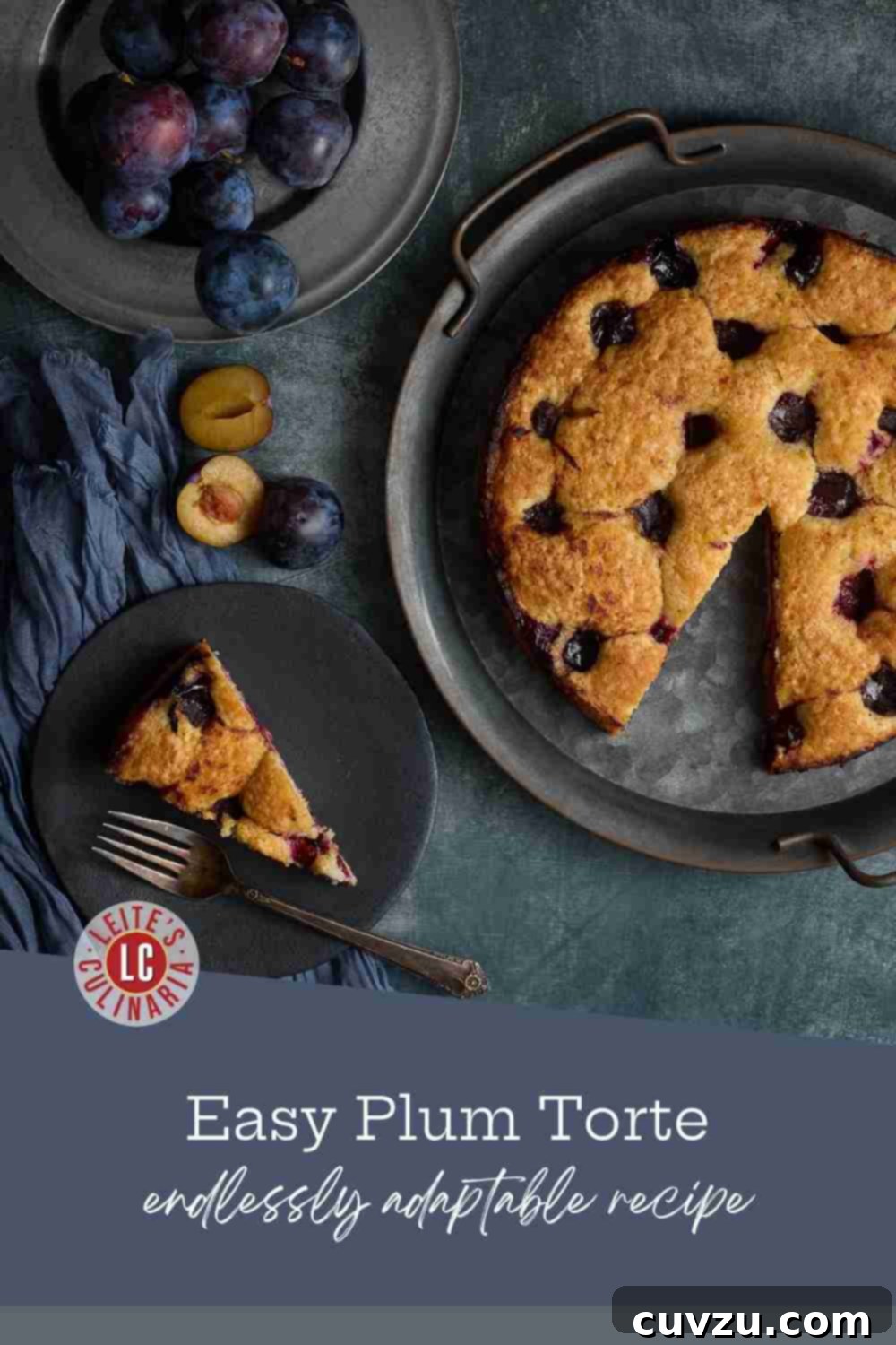 A charming plum tart with a perfect slice removed, surrounded by fresh plums and a single slice on a delicate plate.