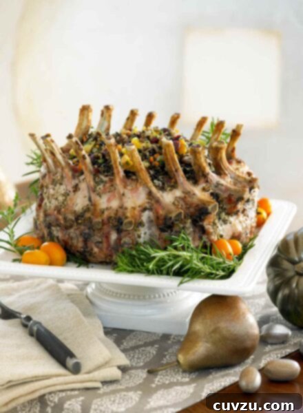 Garlic and Herb Crusted Pork Crown Roast 2 A garlic-herb pork crown roast on a square serving pedestal.