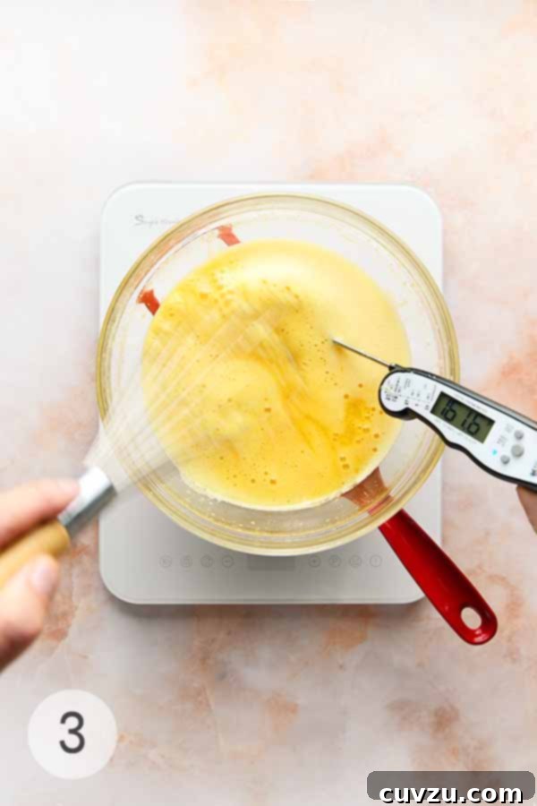 Meyer Lemon Curd: Zesty Citrus Delight 7 A man's hand steadily whisking a bowl of uncooked Meyer lemon curd over a double boiler, ensuring even cooking.