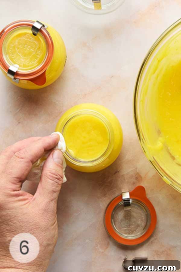 Meyer Lemon Curd: Zesty Citrus Delight 10 Sealed jars of Meyer lemon curd, ready for refrigeration.