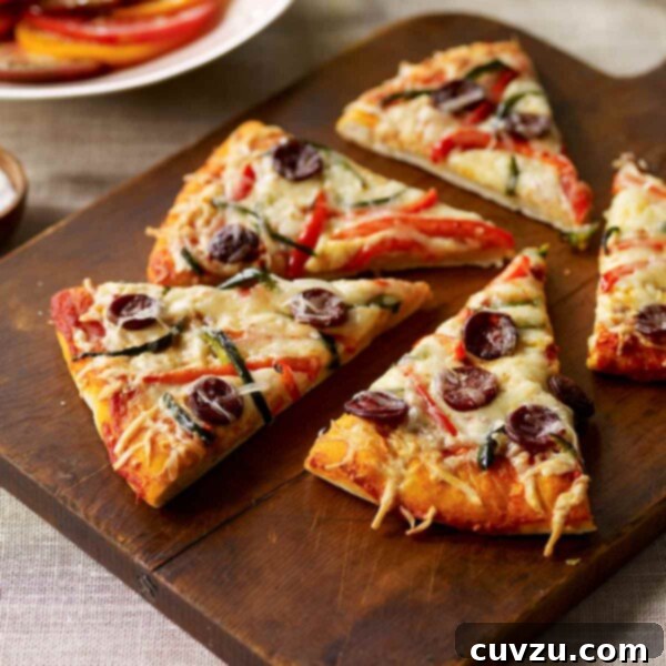 A perfectly baked Spanish pizza slice, rich with chorizo, peppers, and melted cheeses, ready to be enjoyed.