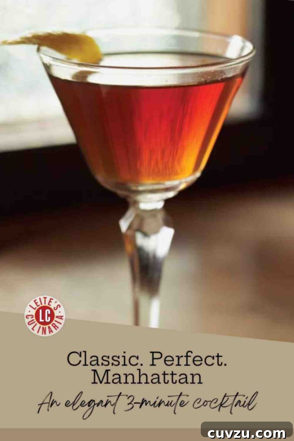 The Quintessential Manhattan 3 A beautiful, amber-red Manhattan cocktail served in an elegant coupe glass, garnished with a bright yellow lemon peel twist.