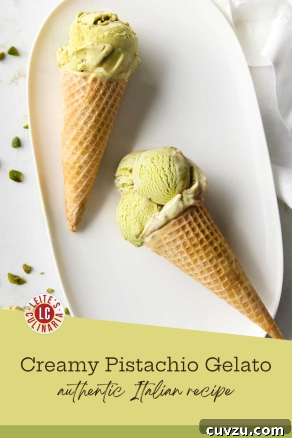 Waffle cones filled with scoops of homemade authentic Italian pistachio gelato, garnished with pistachio pieces, on a white plate.