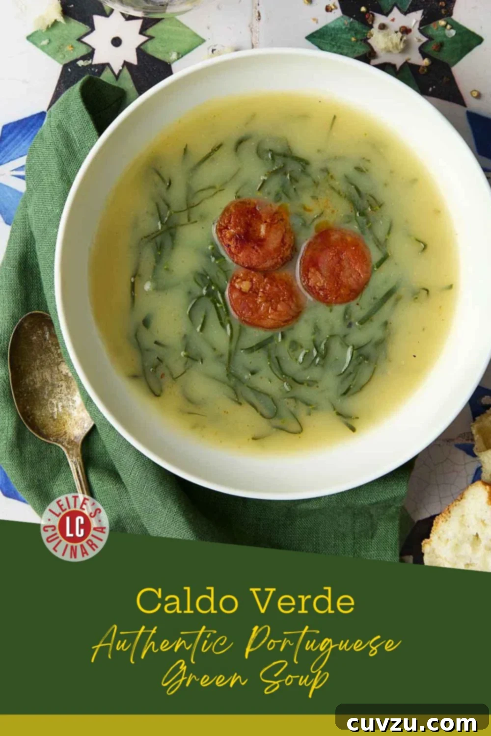 Caldo Verde: Portugal's Iconic Green Soup 3 Caldo verde in a white bowl with sliced chouriço and finely shredded greens on a green napkin.