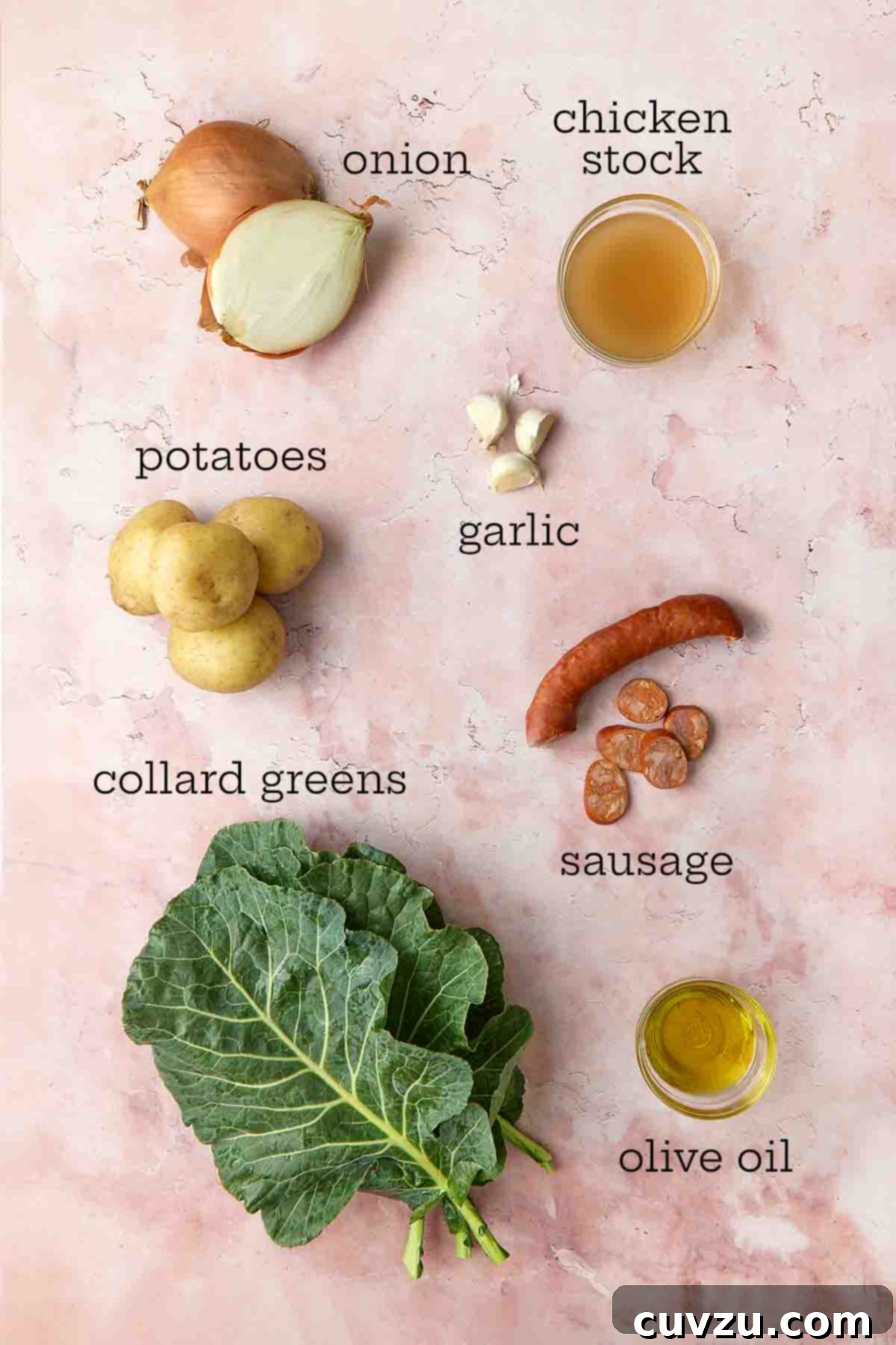 Caldo Verde: Portugal's Iconic Green Soup 5 Ingredients needed for Portuguese caldo verde: onion, chicken stock, potatoes, garlic, collard greens, chouriço sausage, and olive oil, all neatly arranged.