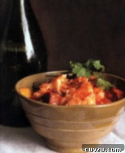 Hearty Portuguese Seafood Chowder 2 A rustic brown ceramic bowl filled with steaming Portuguese Fish Chowder, garnished with fresh cilantro. The chowder contains visible pieces of fish, potatoes, chouriço, and tomatoes, suggesting a rich and hearty meal.