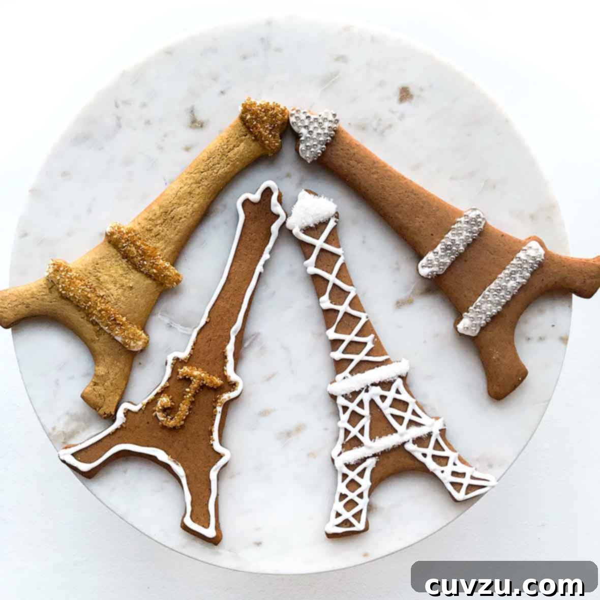 Bold Black Pepper Treats 2 Four Swedish black pepper cookies called pepperkakor cut into Eiffel Tower shapes and decorated