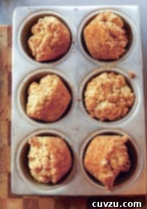Southern Sunrise Biscuit Muffins 3 Six Alabama muffin biscuits in a muffin tin.