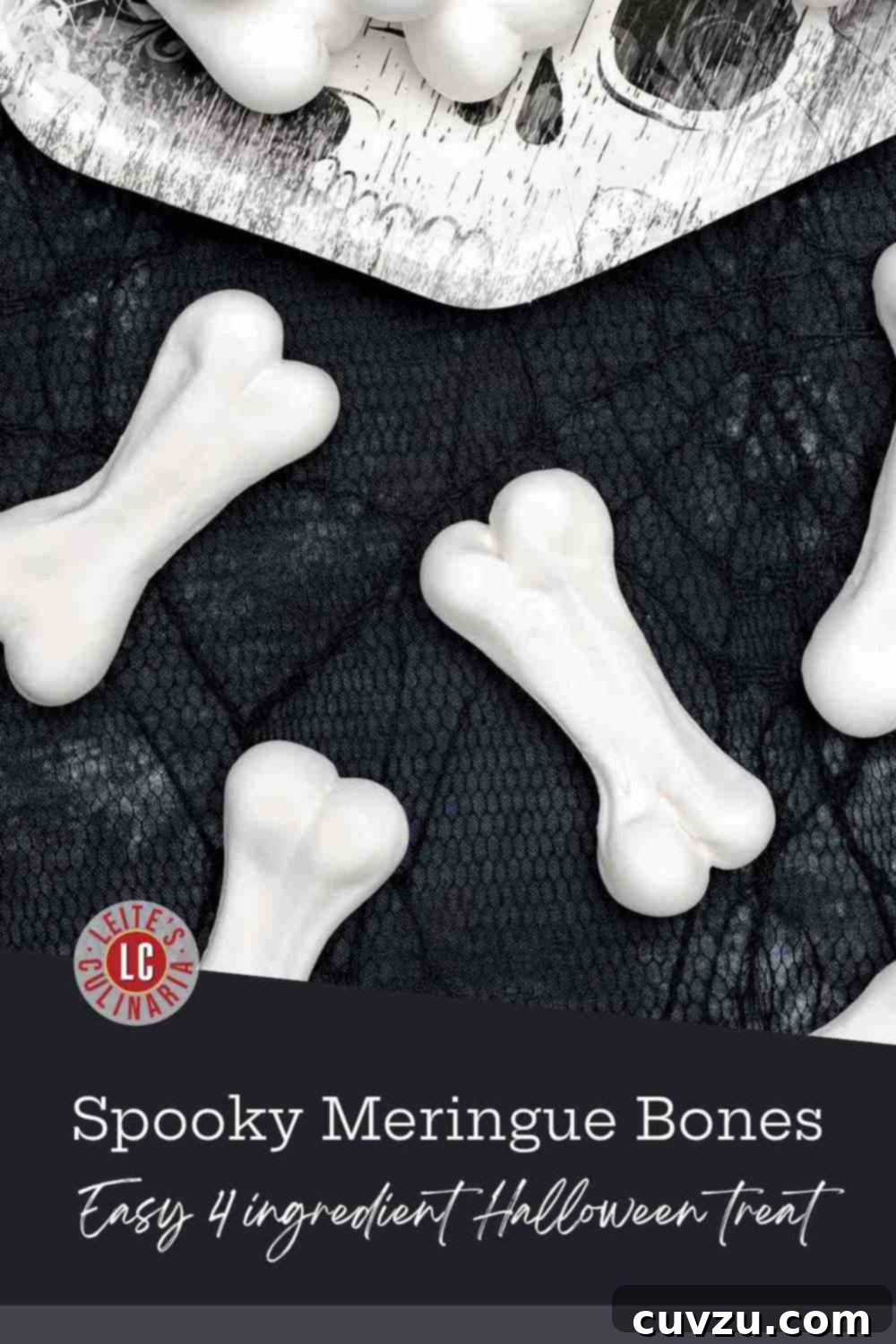 Crisp, white meringue skeleton bones piled on a paper plate against a black cobweb tablecloth, ready for Halloween.