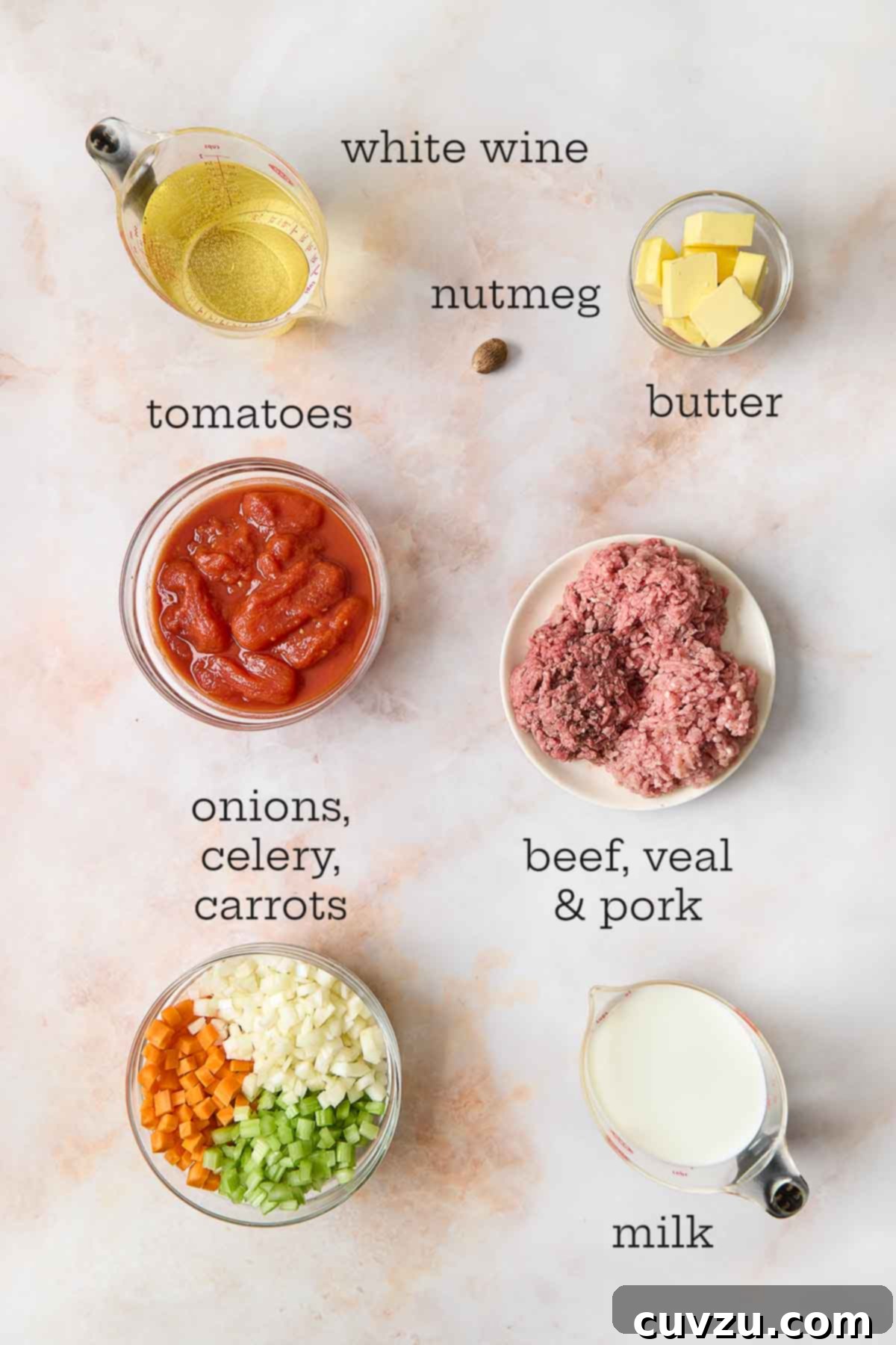 Marcella Hazan's Classic Bolognese 5 Fresh ingredients for Marcella Hazan Bolognese sauce, including chopped onions, carrots, celery, meat, wine, and tomatoes.