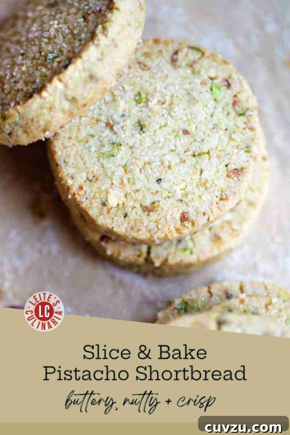 Emerald Pistachio Shortbread Delights 3 Stack of circular, sugar-crusted pistachio shortbread cookies on parchment with cracked pistachios scattered nearby.