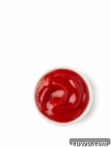 A small white bowl filled with homemade ketchup.
