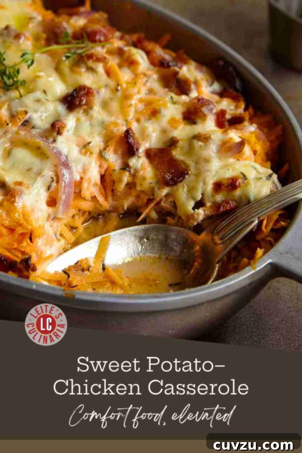 Sweet and Savory Chicken, Sweet Potato, and Bacon Casserole 3 A close-up of a spoon scooping a portion of shredded sweet potato and chicken casserole, showcasing the melted Gruyère, crispy bacon, and fresh thyme on top, highlighting its delicious texture.