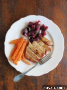 Maple Kissed Pork Chops 3 White plate with a maple pork chops, carrots, and beets with feta cheese