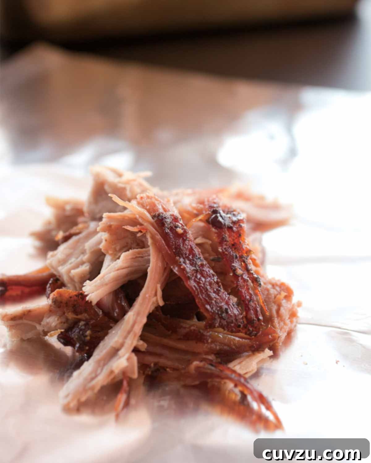 The Ultimate Slow Cooker Pulled Pork 5 A small pile of shredded slow cooker pulled pork.