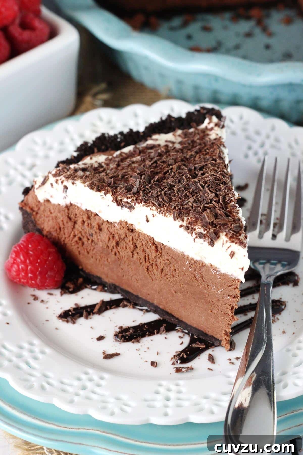Decadent Chocolate Truffle Pie 5 A slice of chocolate truffle pie on a white plate.