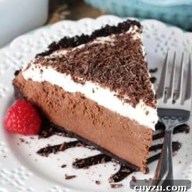 Decadent Chocolate Truffle Pie 9 A slice of chocolate truffle pie on a white plate.