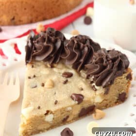 A slice of triple chocolate chip cookie cake on a white plate, featured as the recipe card image.