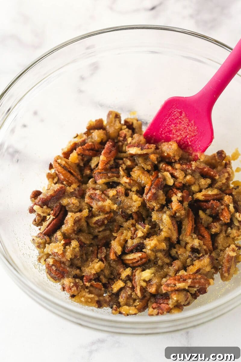 Caramelized Pecan Pumpkin Pie 8 Various ingredients for the pecan praline topping being combined in a bowl.