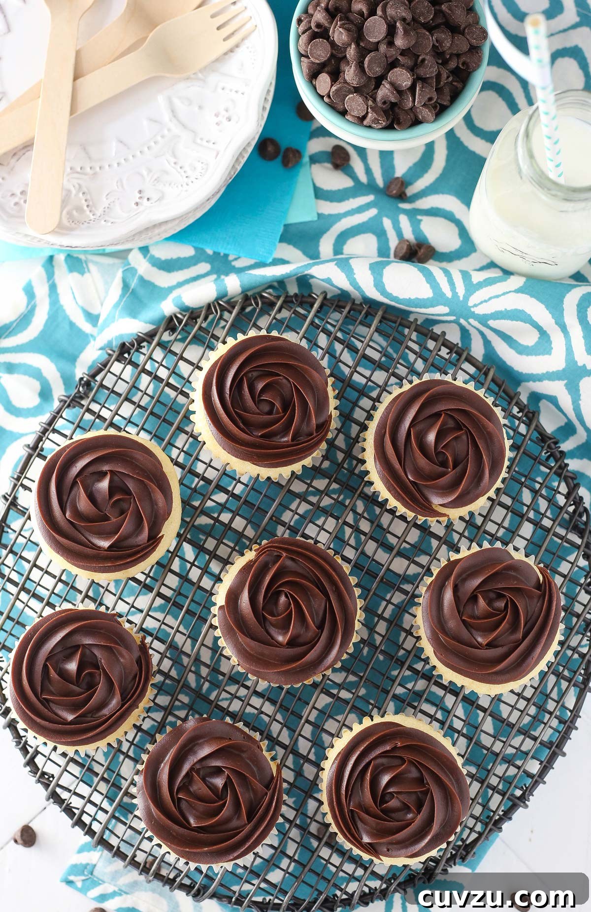 Decadent Boston Cream Cupcakes 4 Overhead view of multiple Boston cream pie cupcakes arranged on a cooling rack.