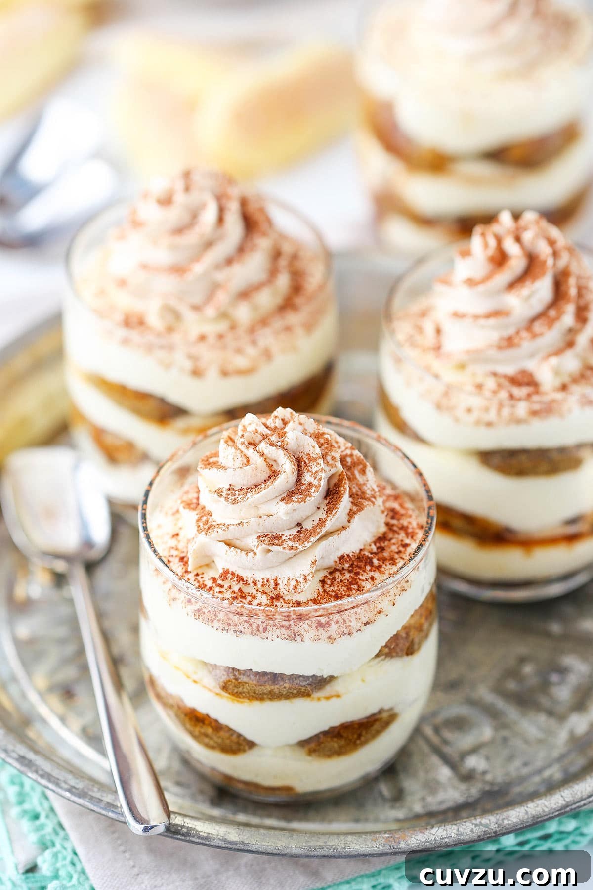 Tiramisu Bites 7 Three no-bake trifles with whipped cream and a dusting of cocoa powder on top of each one