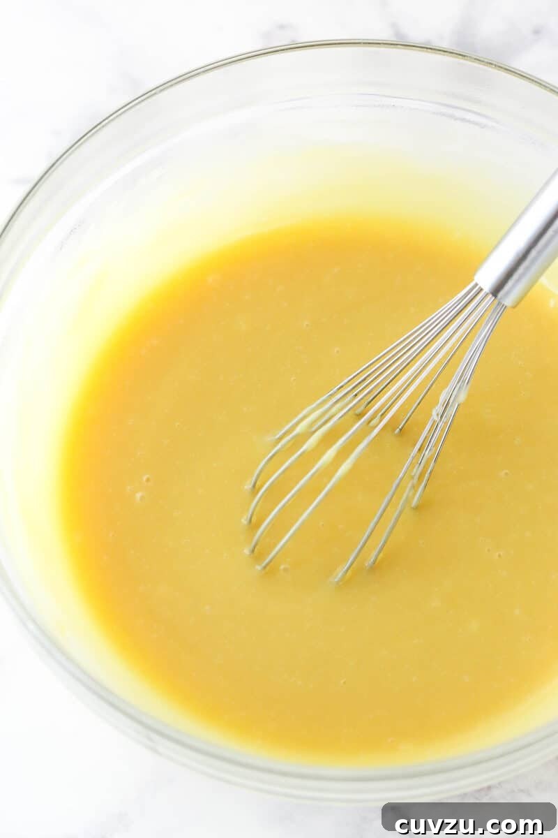 Perfectly salty and sweet, this Salted Honey Pie features a creamy custard-based filling in a classic butter pie crust. Whisking the custard filling