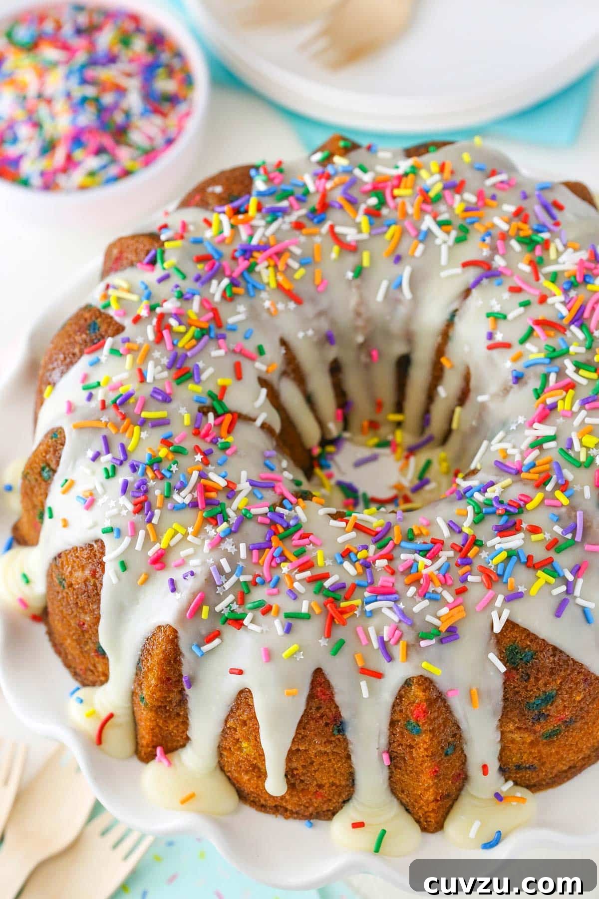 Confetti Joy Bundt Cake 3 An overhead view of a beautifully iced funfetti bundt cake, ready to be served.