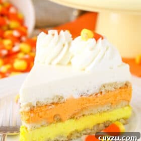 Close up of a slice of candy corn icebox cake.