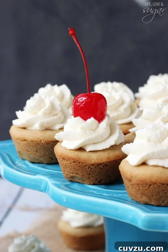 Old-Fashioned Root Beer Float Bites 3 Overhead view of several Root Beer Float Cookie Cups arranged on a white surface, highlighting their uniform size and appealing presentation.