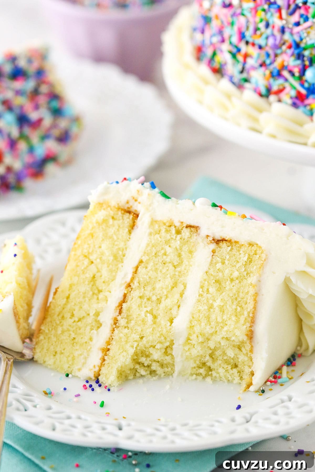 Classic 6-inch Vanilla Delight 5 slice of vanilla cake with a bite taken on white plate