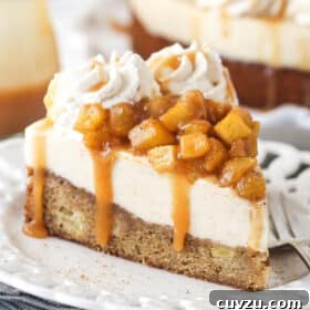 A slice of Caramel Apple Blondie Cheesecake on a small white plate.