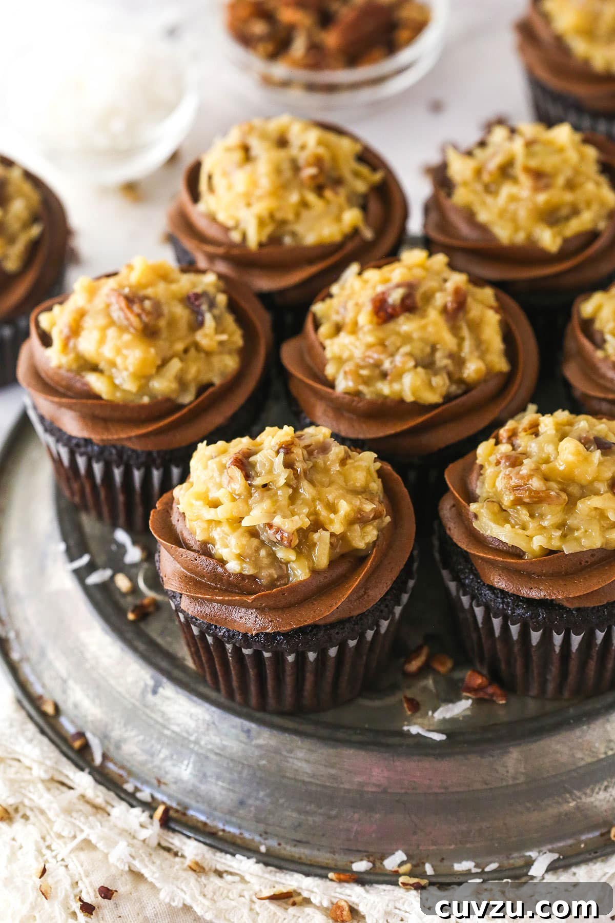 Decadent Black Bottom Cupcakes Recipe — Easy, Gooey Chocolate Centers 3 Overhead image of a platter of German chocolate cupcakes.