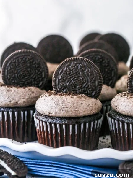 Decadent Black Bottom Cupcakes Recipe — Easy, Gooey Chocolate Centers 6 Closeup of Oreo cupcakes on a serving platter.