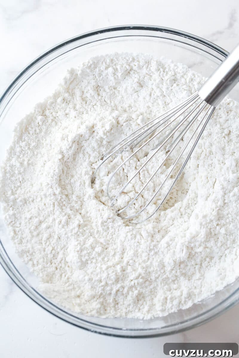 Whisk dry ingredients together Whisking dry cookie ingredients together