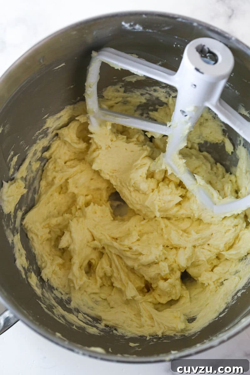 Add egg and extracts Eggs and vanilla added to creamed butter and sugar