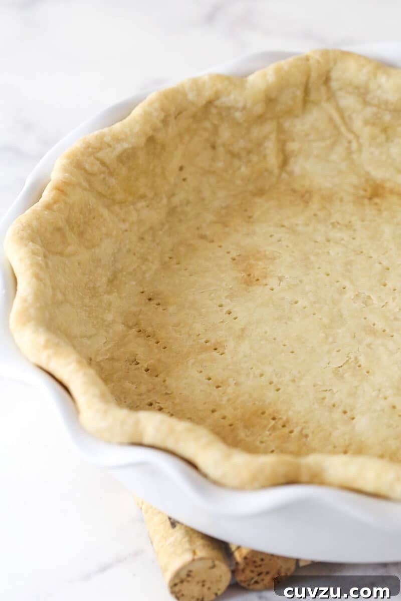 Classic Lemon Meringue Pie Recipe with Flaky Crust and Zesty Filling 4 A partially baked pie crust
