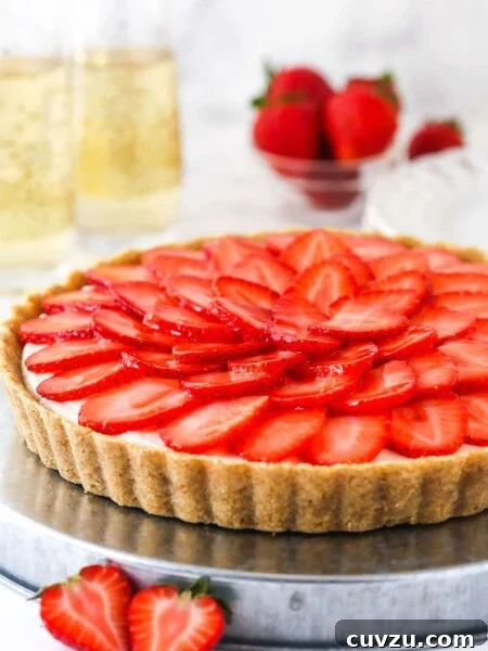 strawberry champagne tart on silver platter