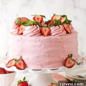 Decorated fresh strawberry cake on a cake stand