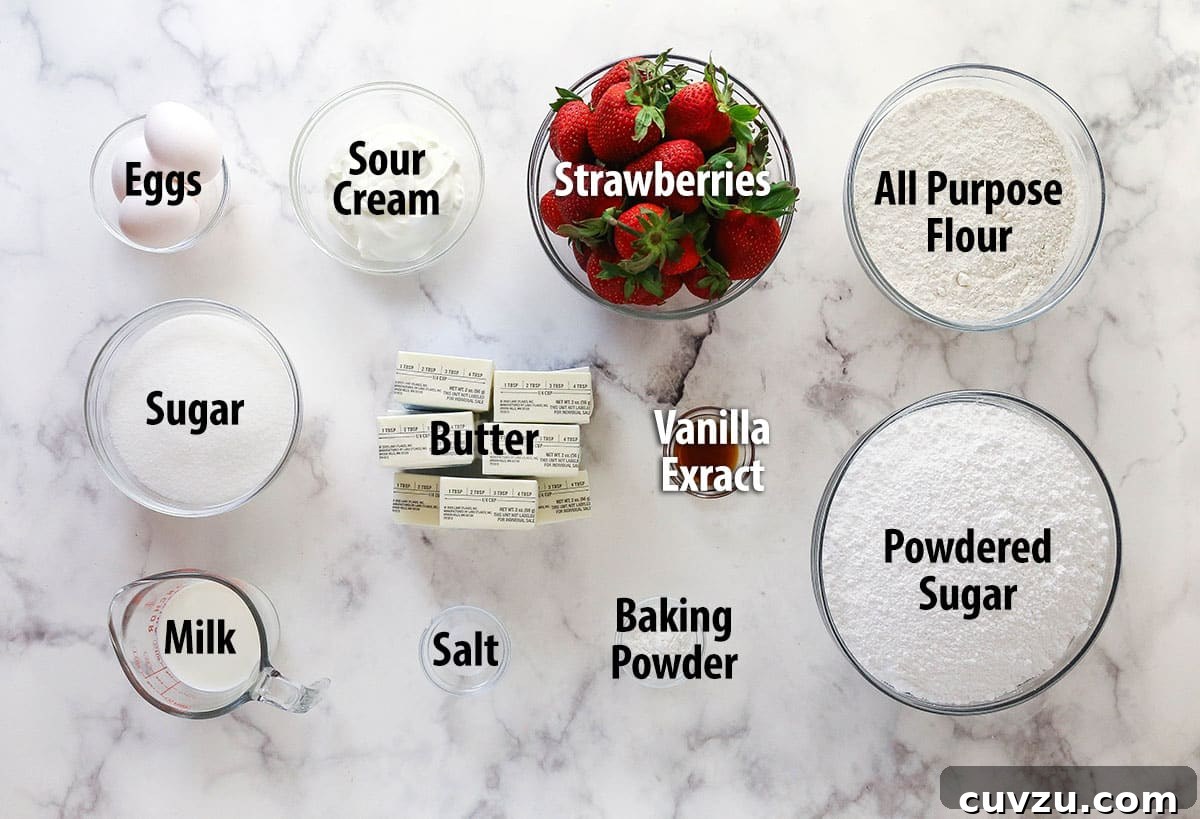 Overhead view of ingredients needed to make fresh strawberry cake