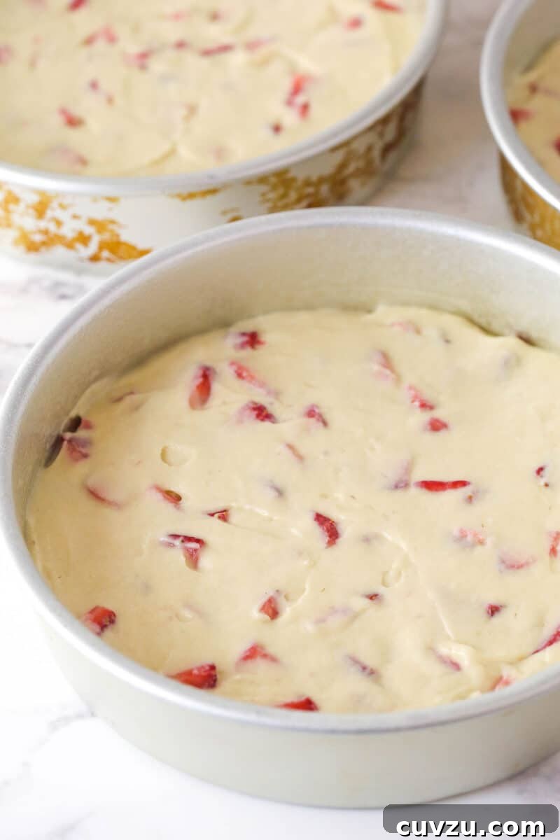 Strawberry cake batter in a round pan